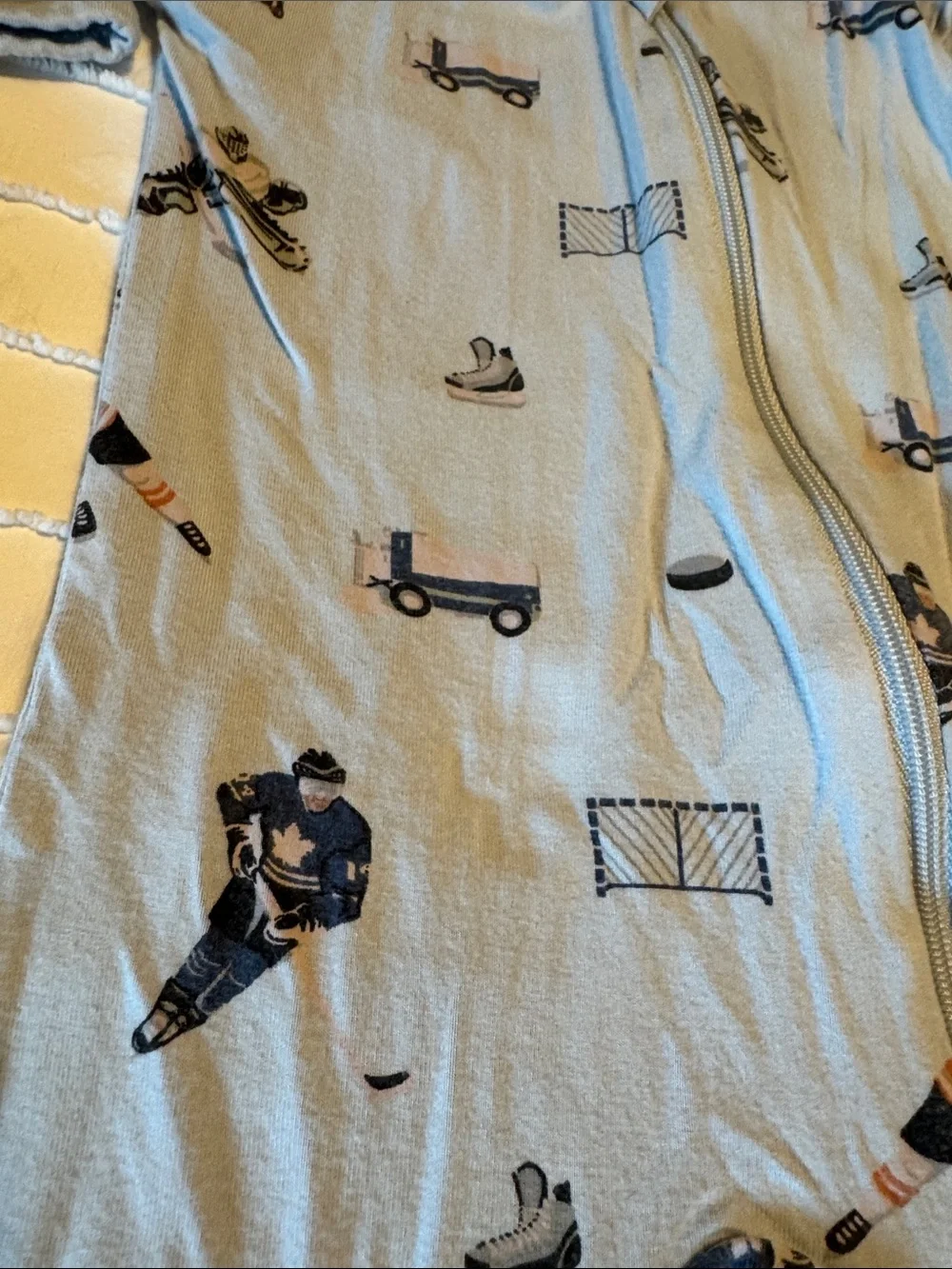 Kyte BABY 6-12 mo Light Blue Hockey & Skate Print Footed One-Piece